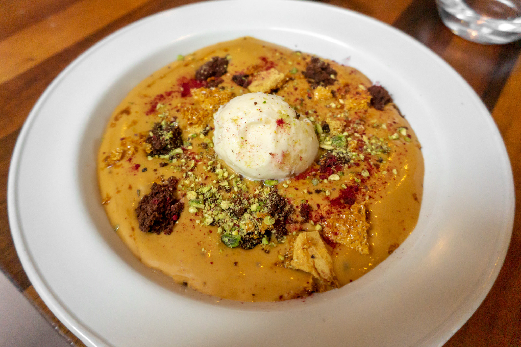 Hot white chocolate mousse with stem ginger ice cream