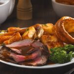 Roast beef dinner with vegetables and Yorkshire pudding