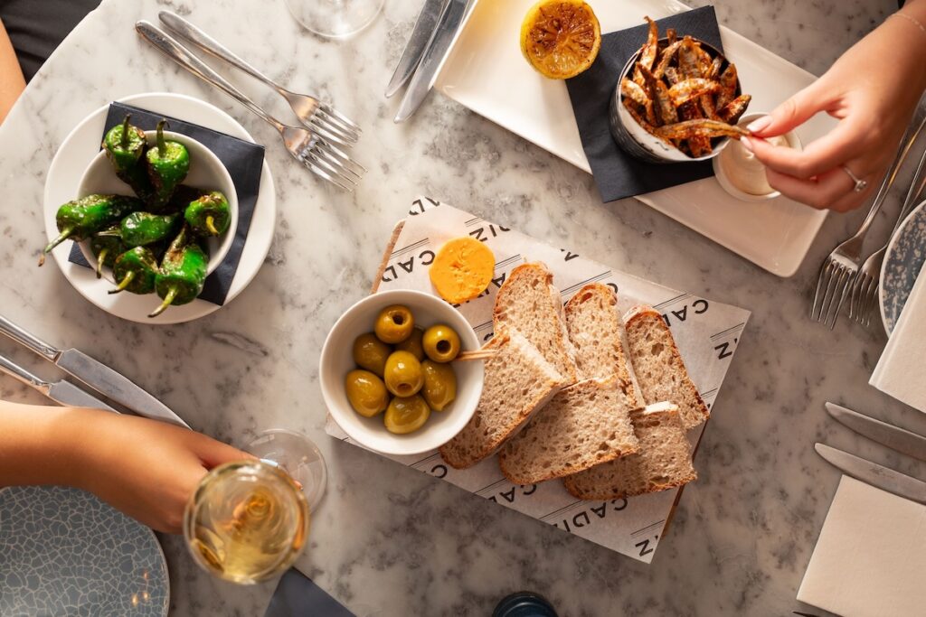 Small plates including olives and padron peppers